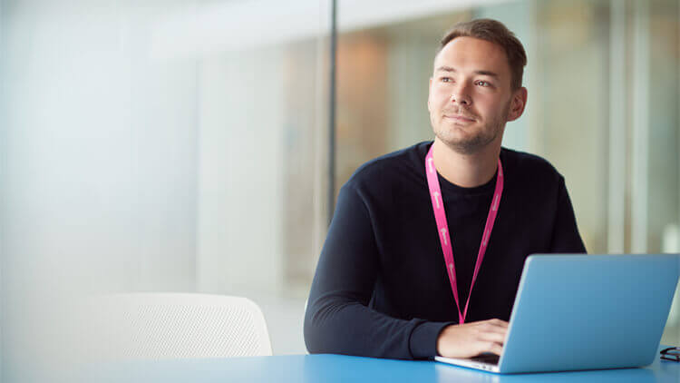 Man sitting a desk with a computer