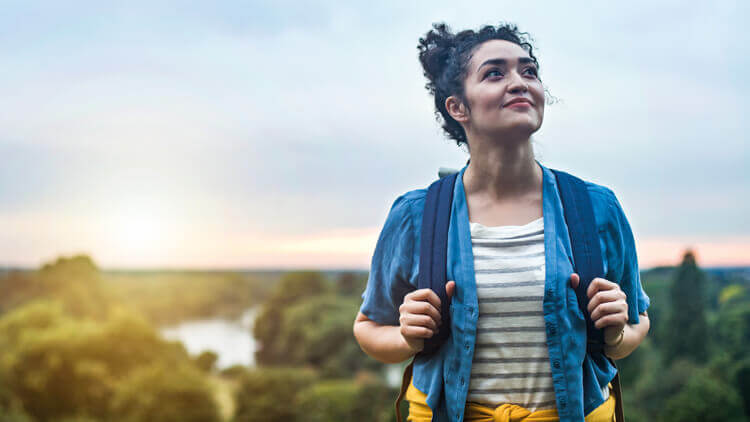 Young woman out on a walk in the country