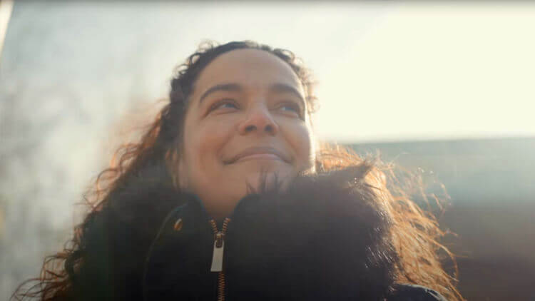 A young woman, looking optimistic